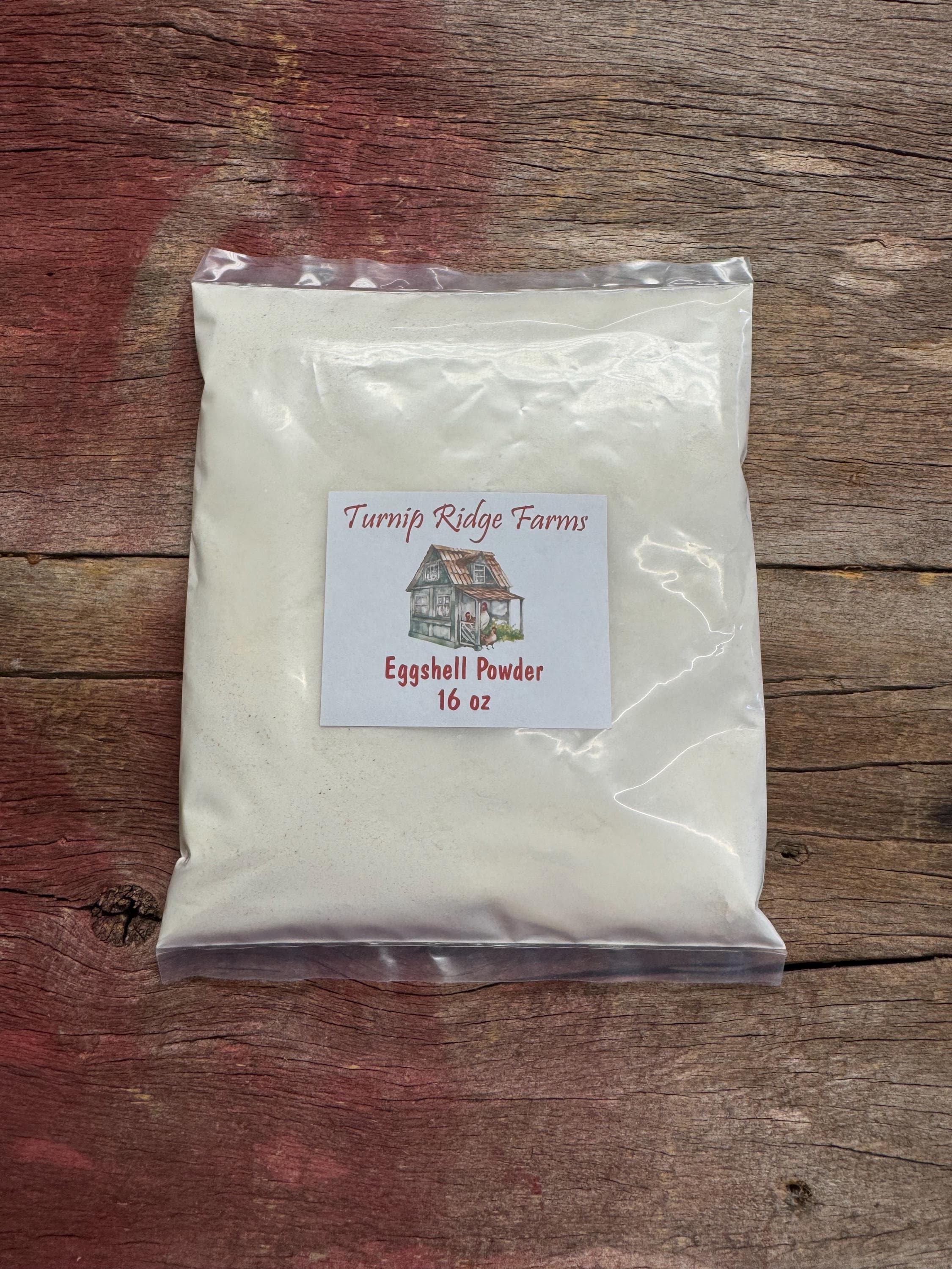 Bag of Turnip Ridge Farms eggshell powder on a wooden surface