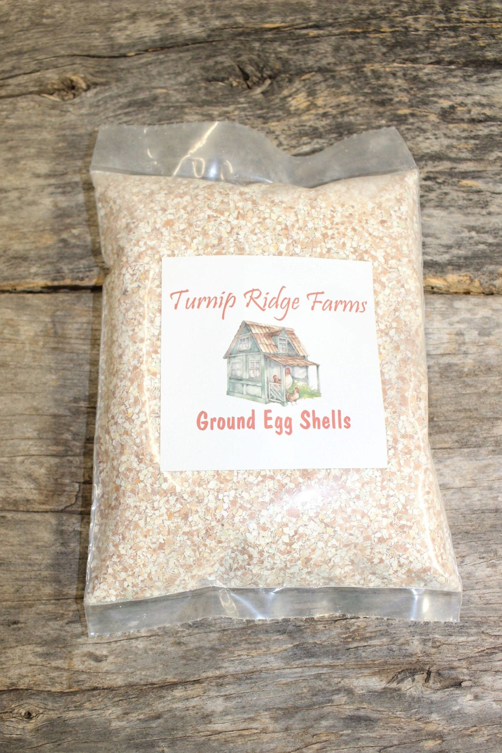 Bag of Turnip Ridge Farms ground egg shells on a wooden surface